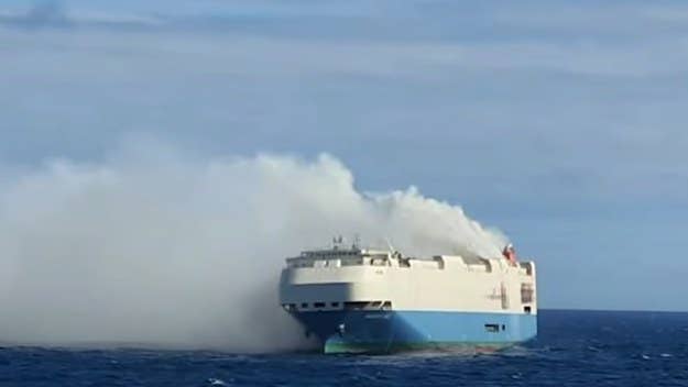 The entire 22-person crew was rescued from the vessel, which carried thousands of cars, earlier this week. The cause of the fire remains unknown.