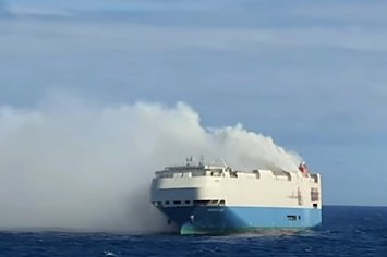 A car transport vessel is seen on fire
