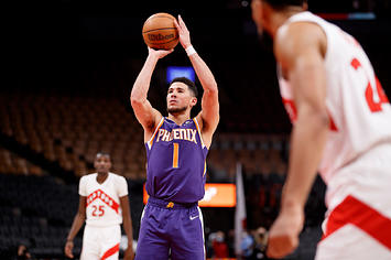 Devin Booker #1 of the Phoenix Suns takes a foul shot during the second half of their NBA game against the Raptors