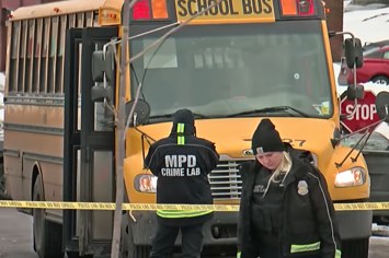 A bus is pictured at a crime scene after a shooting