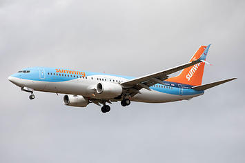 A TUI Airways Boeing 737 in Sunwing of Canada colours lands at Newcastle Airport on 7th September 2020