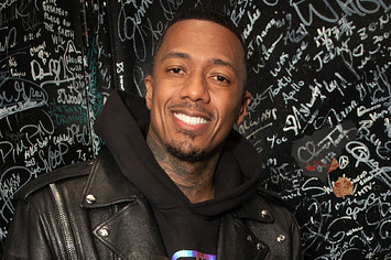 Nick Cannon is pictured posing for a photo