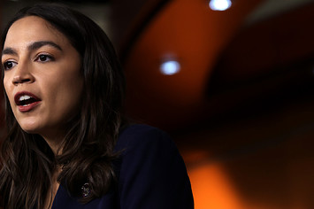 AOC is seen speaking during an event