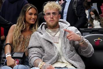 Jake Paul and his girlfriend Julia Rose pose after the game between the Miami Heat and the Detroit Pistons