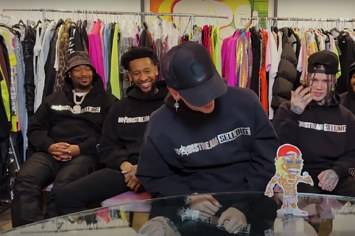 Machine Gun Kelly and friends are pictured wearing matching hoodies