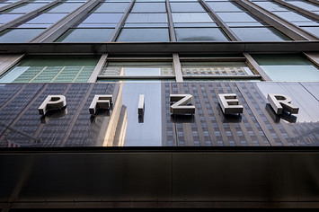 A logo for Pfizer is shown on a building