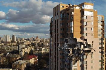 This general view shows damage to the upper floors of a building in Kyiv