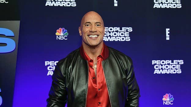 The WWE wrestler-turned-action star joined the Elmo vs. Rocco feud by confirming "The Rock" does, indeed, eat cookies: "Tell Cookie Monster to move it over."