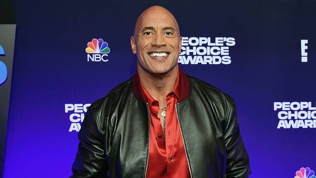 The WWE wrestler-turned-action star joined the Elmo vs. Rocco feud by confirming "The Rock" does, indeed, eat cookies: "Tell Cookie Monster to move it over."