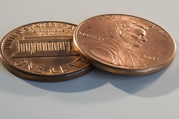 A stock photo of two pennies close up.