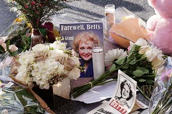 Betty White's Walk of Fame star surrounded by flowers