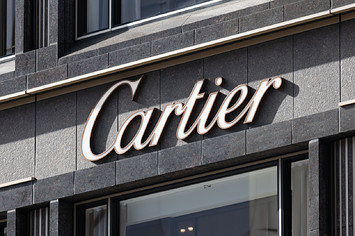 A logo for the Cartier brand is shown