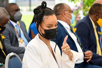 Rihanna Fenty gestures prior to speaking as she is named Barbado's 11th National Hero during the National Honors ceremony.