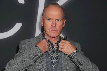 Michael Keaton poses for photographers at premiere event.