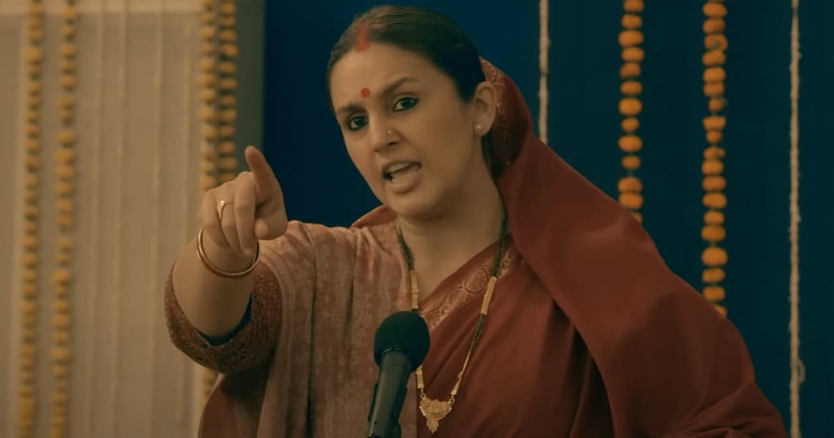 Huma Qureshi speaking into a mic and pointing at someone angrily