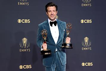 Jason Sudeikis holds Emmy Awards