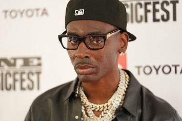 young dolph on a red carpet in glasses