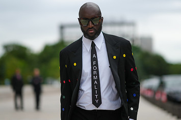 Virgil Abloh wears glasses and a tie.
