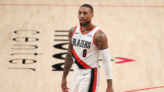 Damian Lillard reacted to a meme calling out Woj for blaming him for the Blazers' front office issues after they just fired former GM Neil Olshey.
