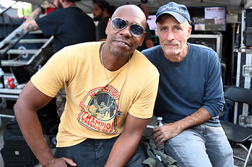 Dave Chappelle and Jon Stewart pose for photo together during Dave Chappelle's Block Party.