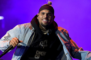 Chris Brown performing on stage in 2019 while on tour