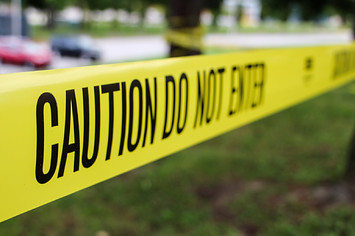 Caution Do Not Enter tape at crime scene