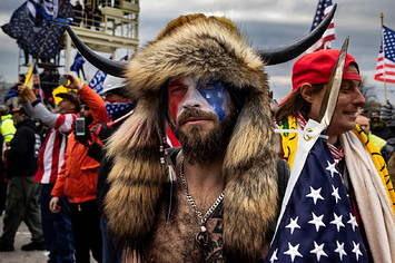 A rioter in costume is seen at the Capitol.
