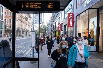Masked walkers spotted on Oxford Street in London