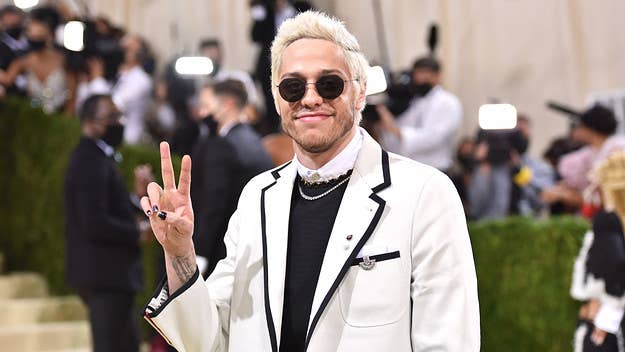 Pete Davidson was seen hanging out with a group that included Kim Kardashian, sister Kourtney, Travis Barker, and more at Knott's Berry Farm.