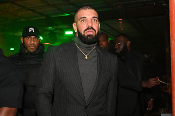 Drake wears a blazer at an event.