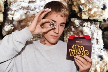 Justin Bieber posing with a box of Timbiebs for his new Tim Hortons campaign.