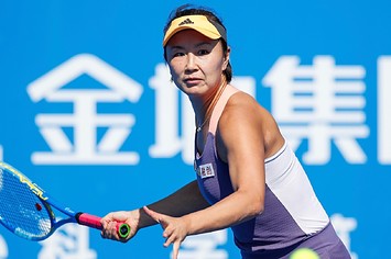 Peng Shuai of China returns a shot during the women's singles