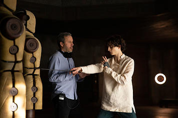 Director/co-writer/producer DENIS VILLENEUVE and TIMOTHÉE CHALAMET on the set of Dune