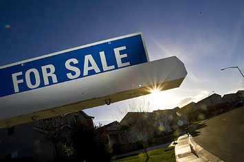 Image of a for sale sign at a home