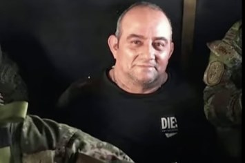 Drug lord "Otoniel" smiling after being arrested