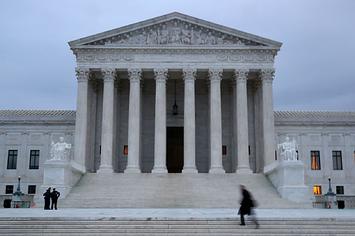 A man walks up the steps of the U.S. Supreme Court