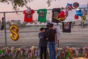 People pay their respects at the site of the Astroworld 2021 crowd crush.