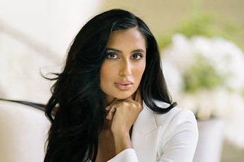 Nisha Grewal in a white suit