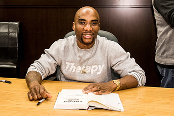 Charlamagne of 'The Breakfast Club' fame signing a book.