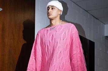 Kyle Kuzma seen in his pink sweater before Monday's game