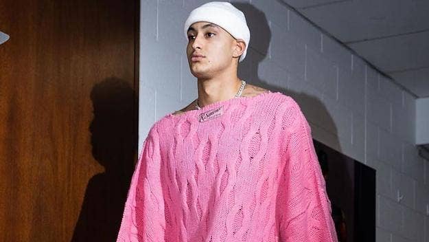 Before the Washington Wizards faced off against the Charlotte Hornets Monday, Kuzma entered the arena rocking a pink oversized Raf Simons sweater.