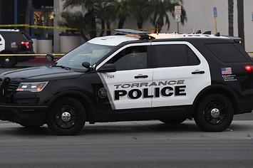 A police cruiser is pictured in a parking lot.