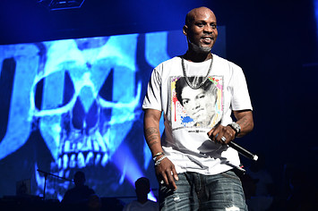 DMX pictured onstage with logo behind him