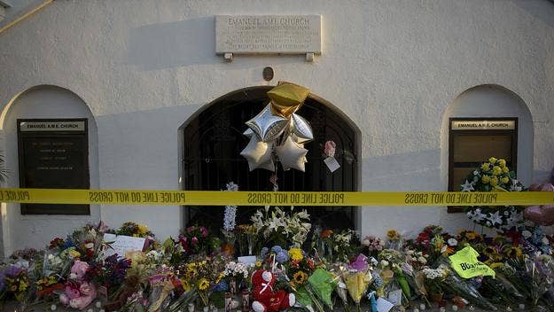 Victims' families in the 2015 racist attack on a church in Charleston have reached a settlement with the Justice Department over Dylann Roof's background check.