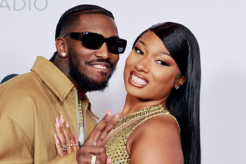Pardison Fontaine and Megan Thee Stallion take photo together at award show.