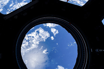 A view from inside the Space Station is shown.