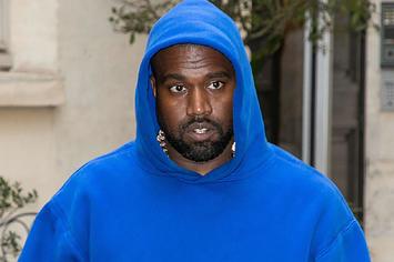 Kanye West spotted in blue hoodie