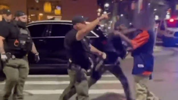 A video showing a police officer appearing to punch a man in the face has gone viral and led to an investigation. The incident occurred in Detroit's Greektown.