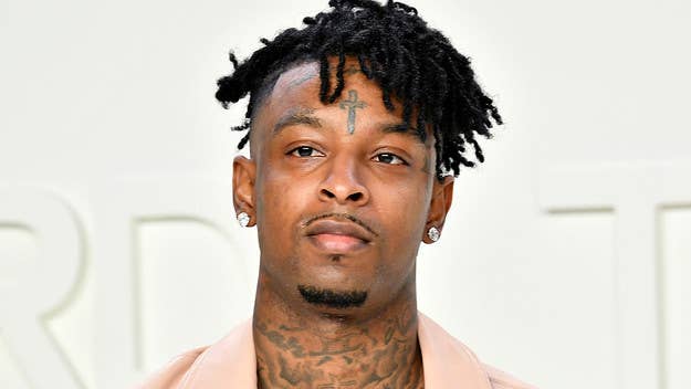 A conversation between 21 Savage and 6ix9ine on the social media platform Clubhouse turned heated after Wack 100 threatened to beat up the Atlanta rapper.