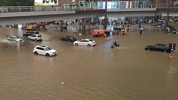 Severe flooding in a major city in China has killed 12 people and left many trapped in subway trains and cars as they wait for rescue workers to save them.
